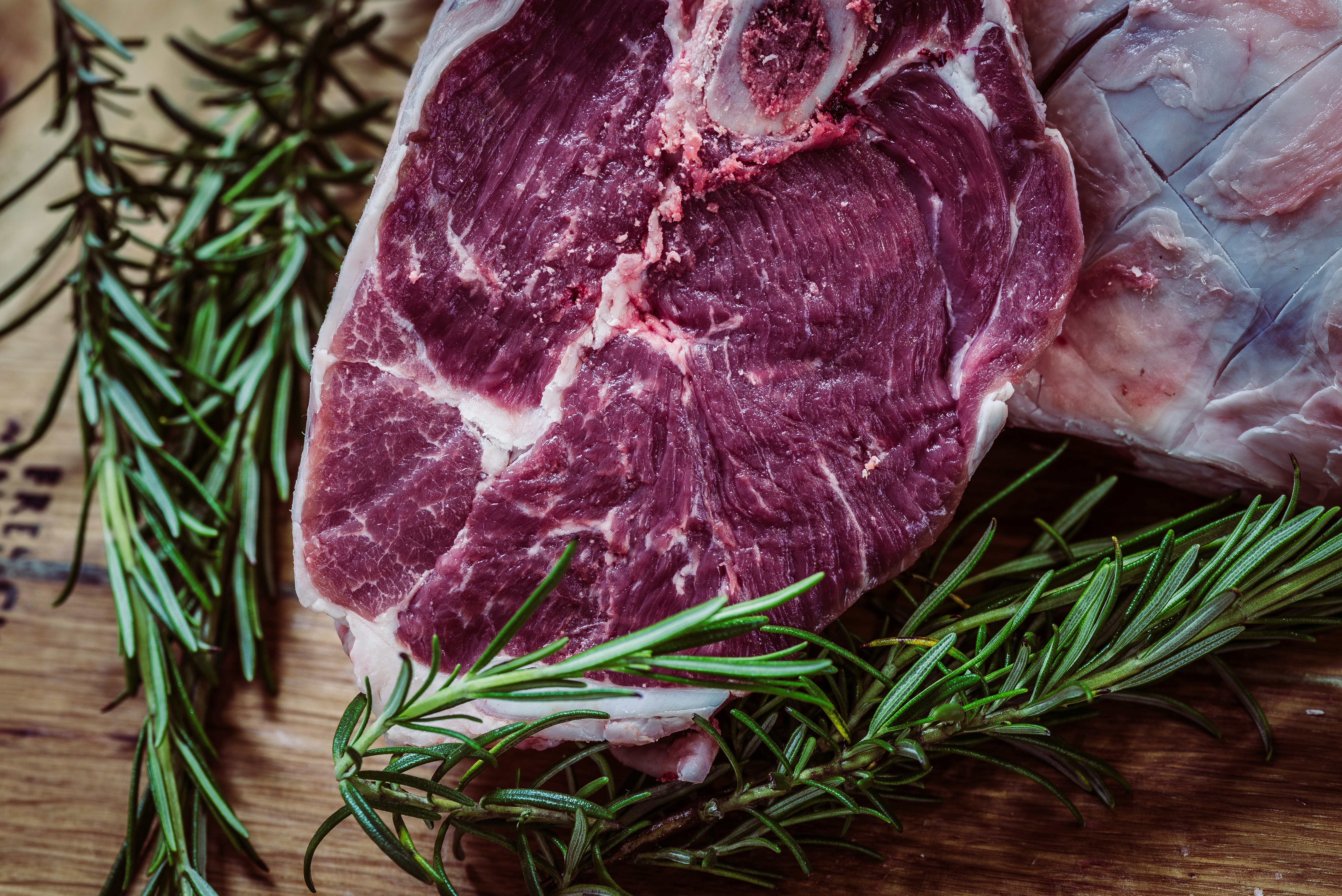 Fresh cut of high-quality halal beef with rosemary, available at International Food Market Orlando, specializing in premium halal meats for the Orlando community.