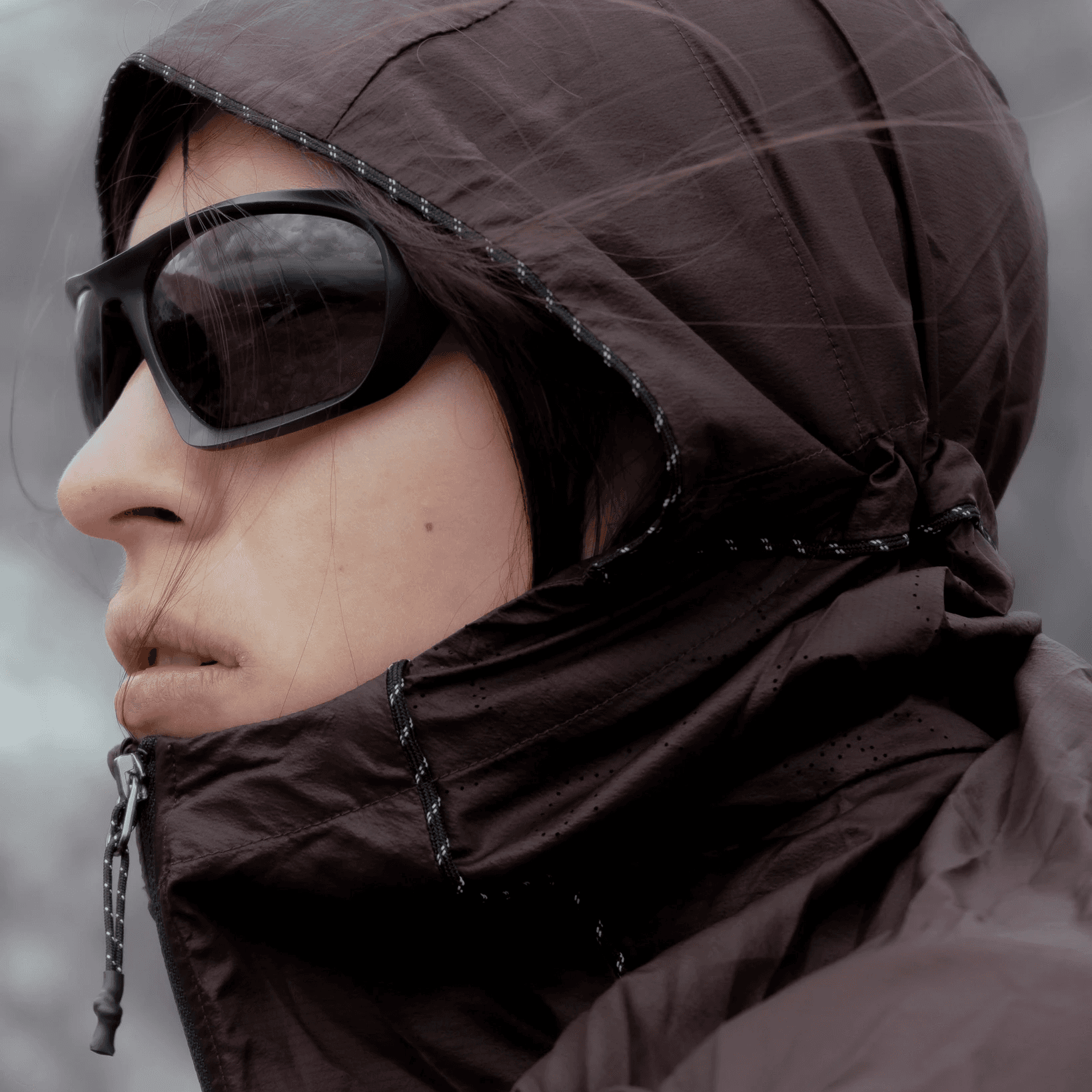 portrait of a woman in running glasses.