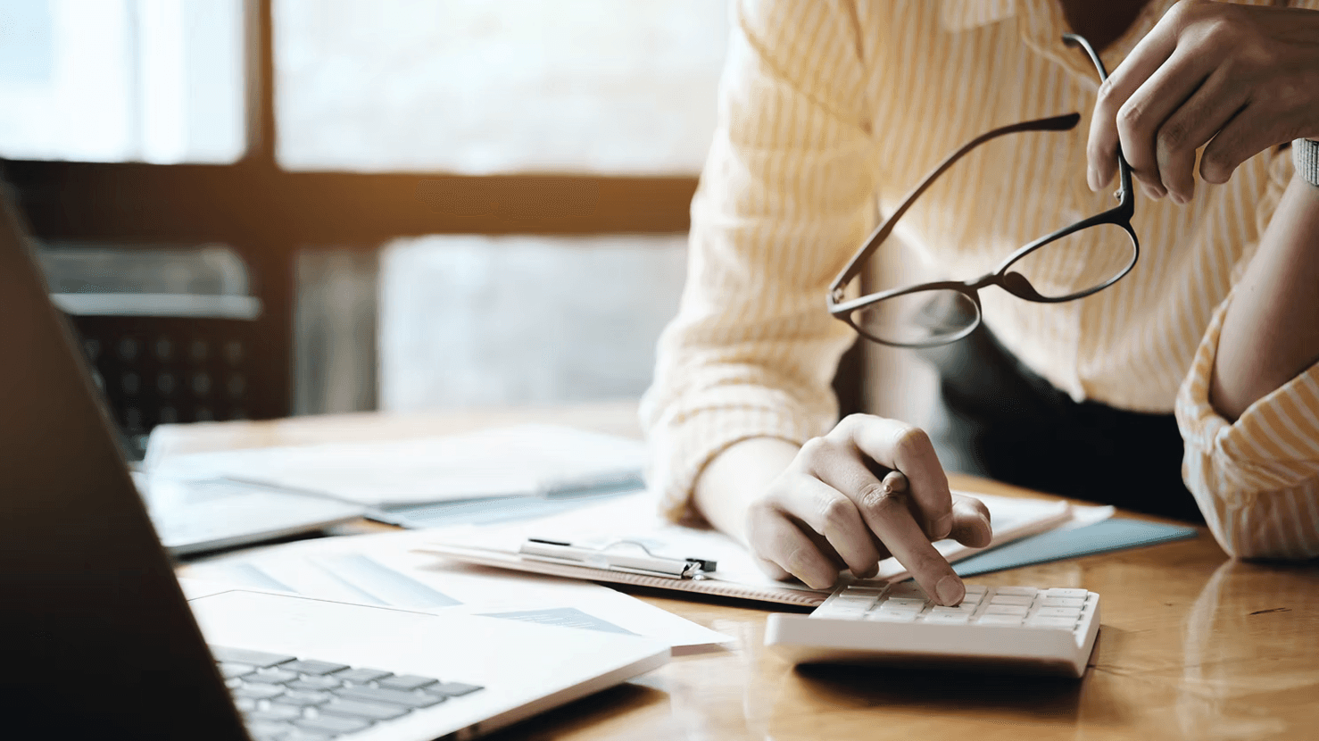 Woman takes time to send a professional invoice as a freelancer
