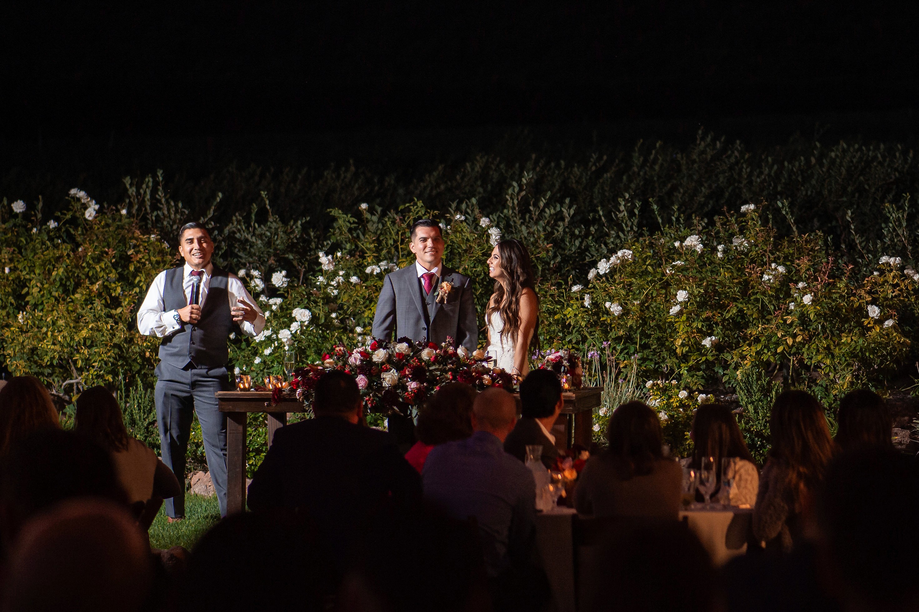 Flat lay wedding details with bouquet, rings, and sparkling bridal heels