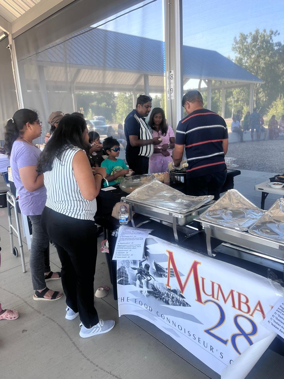 An image of the founder serving food to customers