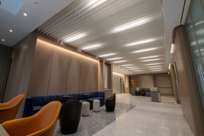 A office with modern looking chairs and tasteful lighting