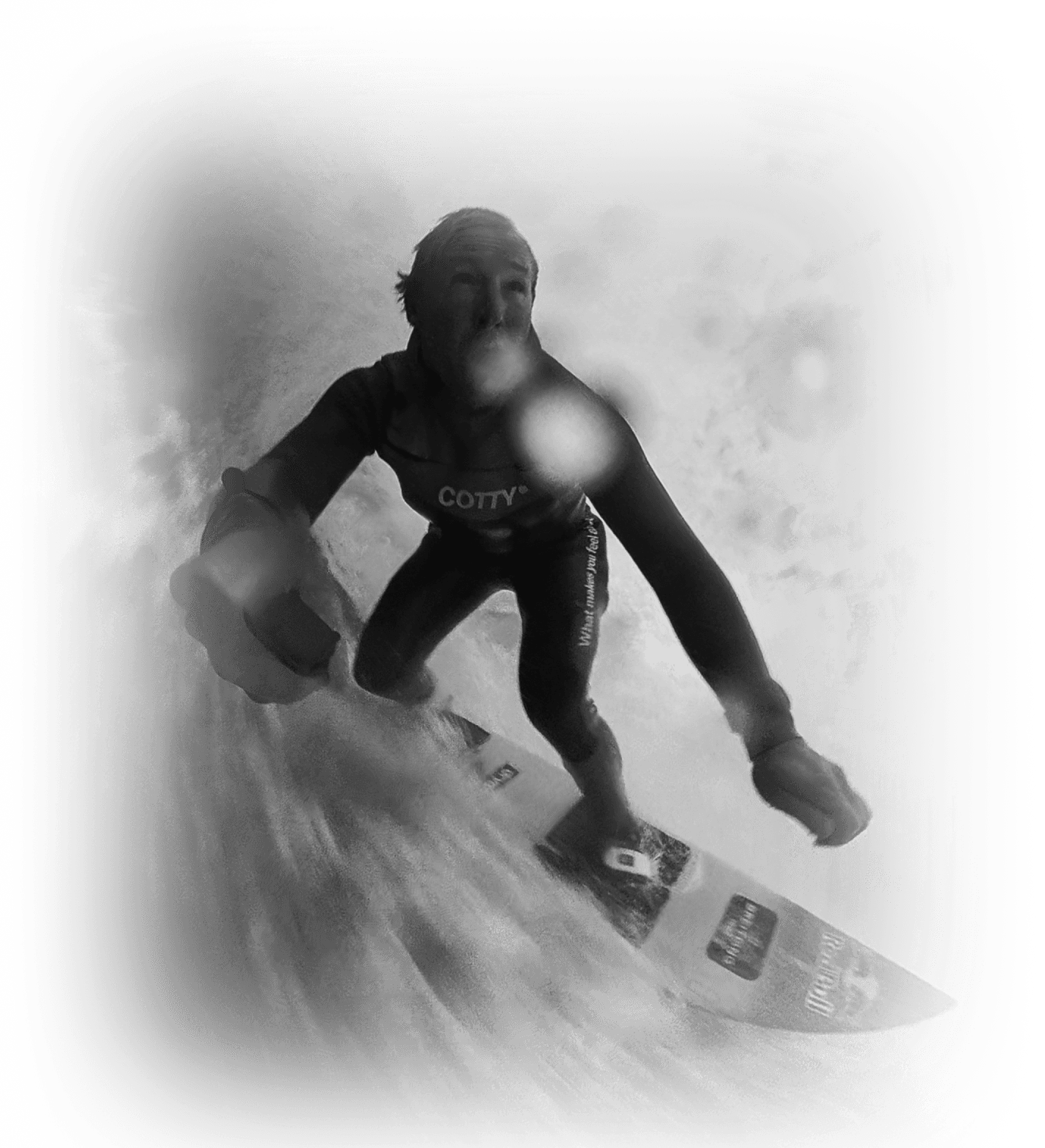 Andrew Cotton surfing beneath a breaking wave