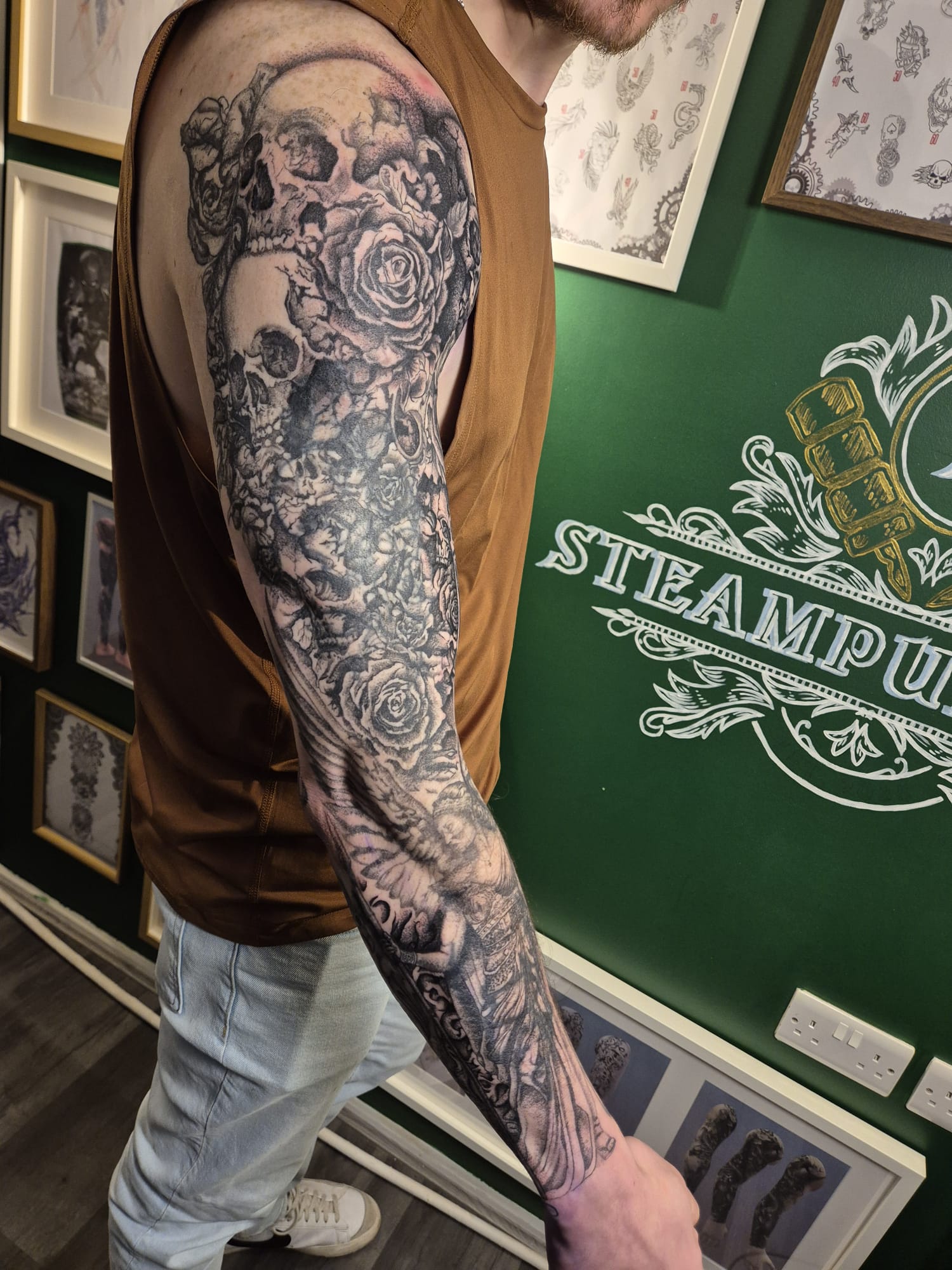 Black and grey forearm tattoo sleeve with dragon and shading in Hazel Grove