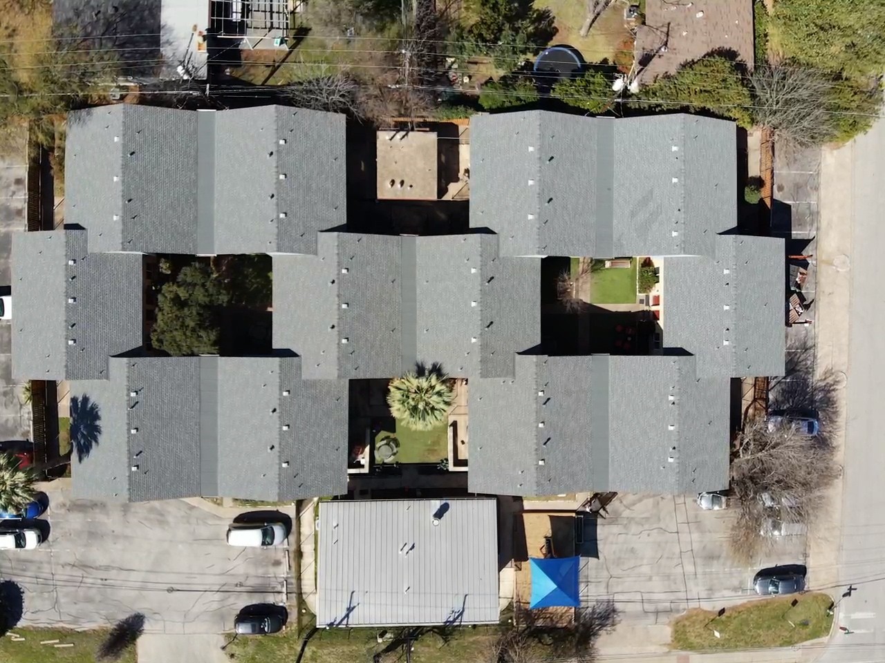 After photo of a large south austin aparment complex with GAF HDZ shingles. 