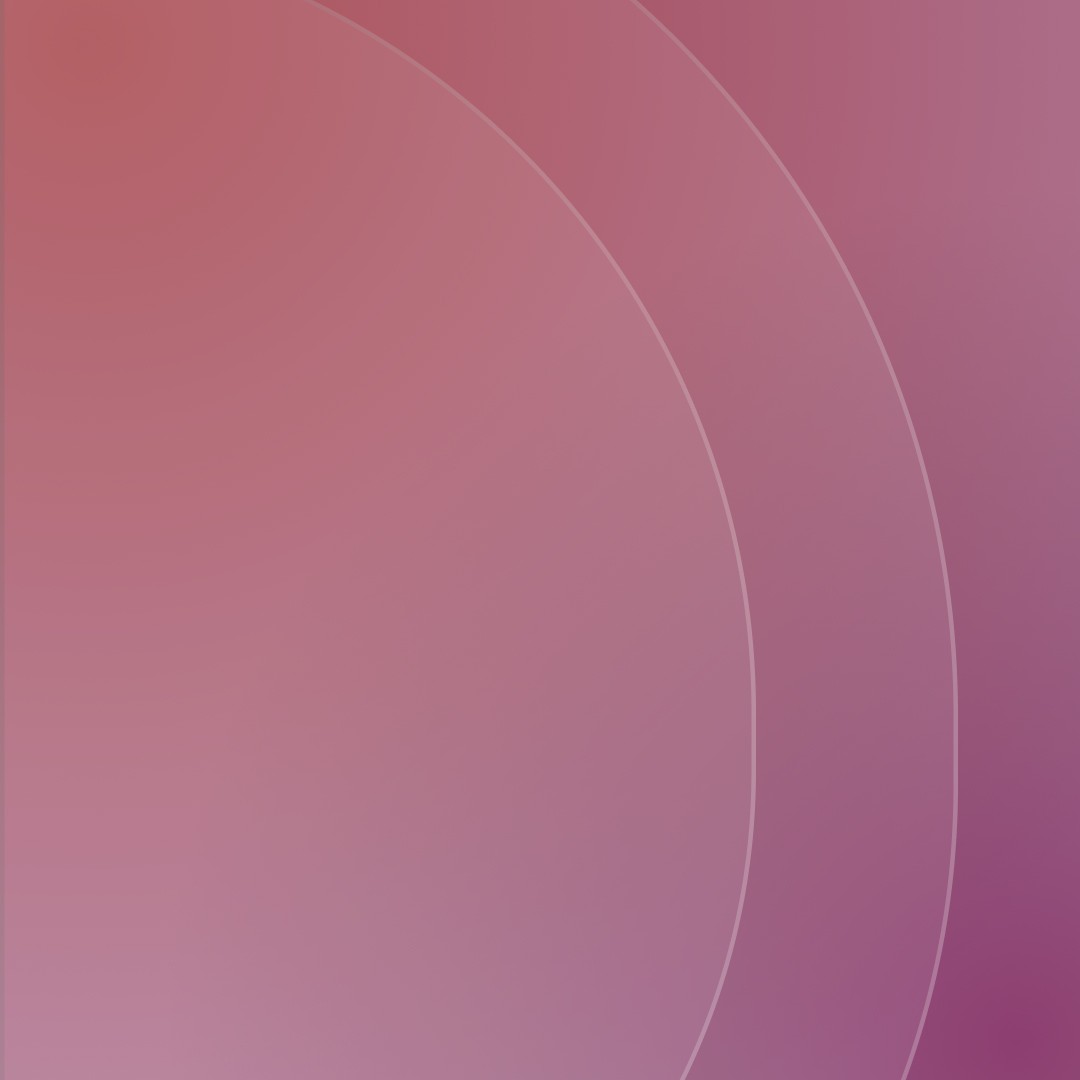 Rocky lakeside with evergreen trees and a mountain rising in the background under cloudy sky.