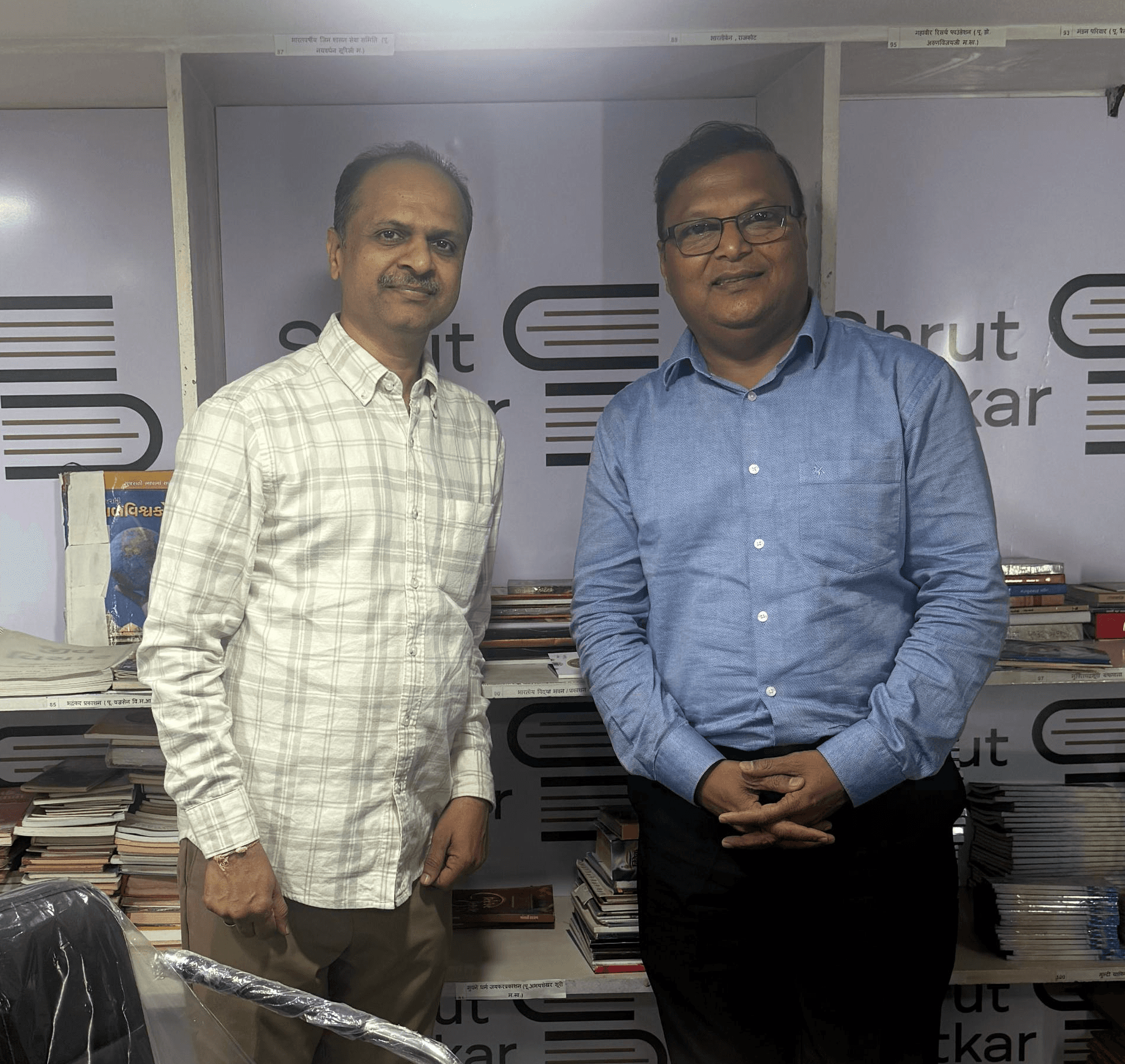 a black and white living room with a large tv