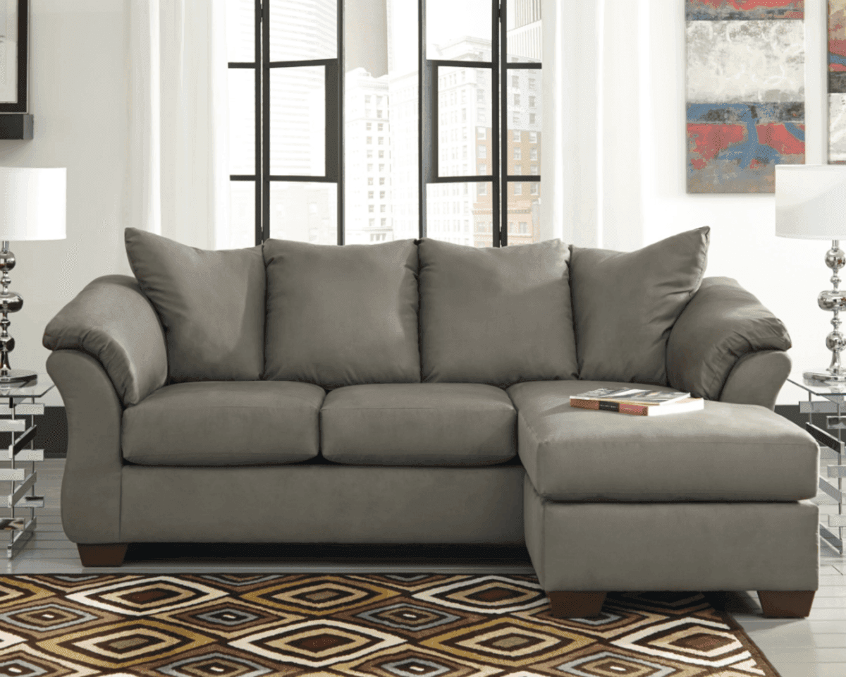 Gray Signature Design by Ashley Darcy sofa chaise in a bright living room with large windows and geometric rug