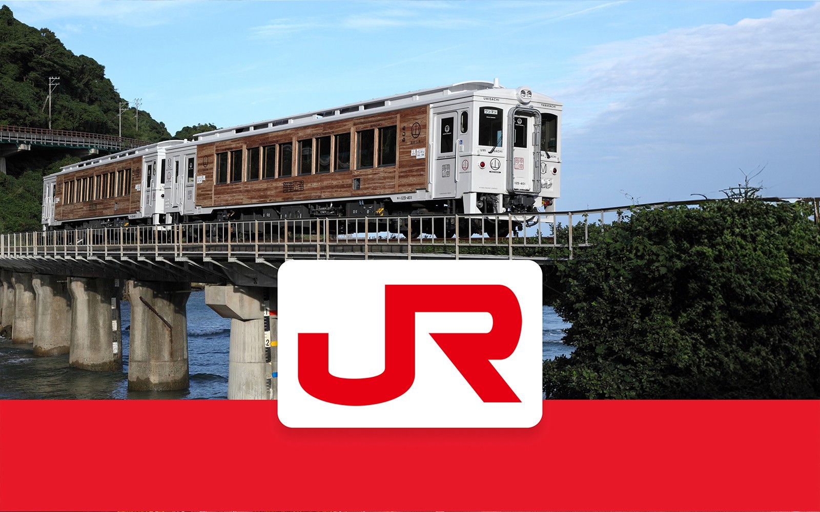 Train crossing a bridge in Kyushu, Japan, with JR logo in foreground.