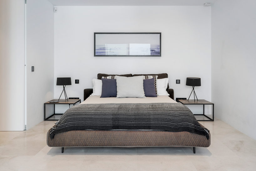 Suite Two monochrome living area with pool and garden views at Luxury Villa Ibiza