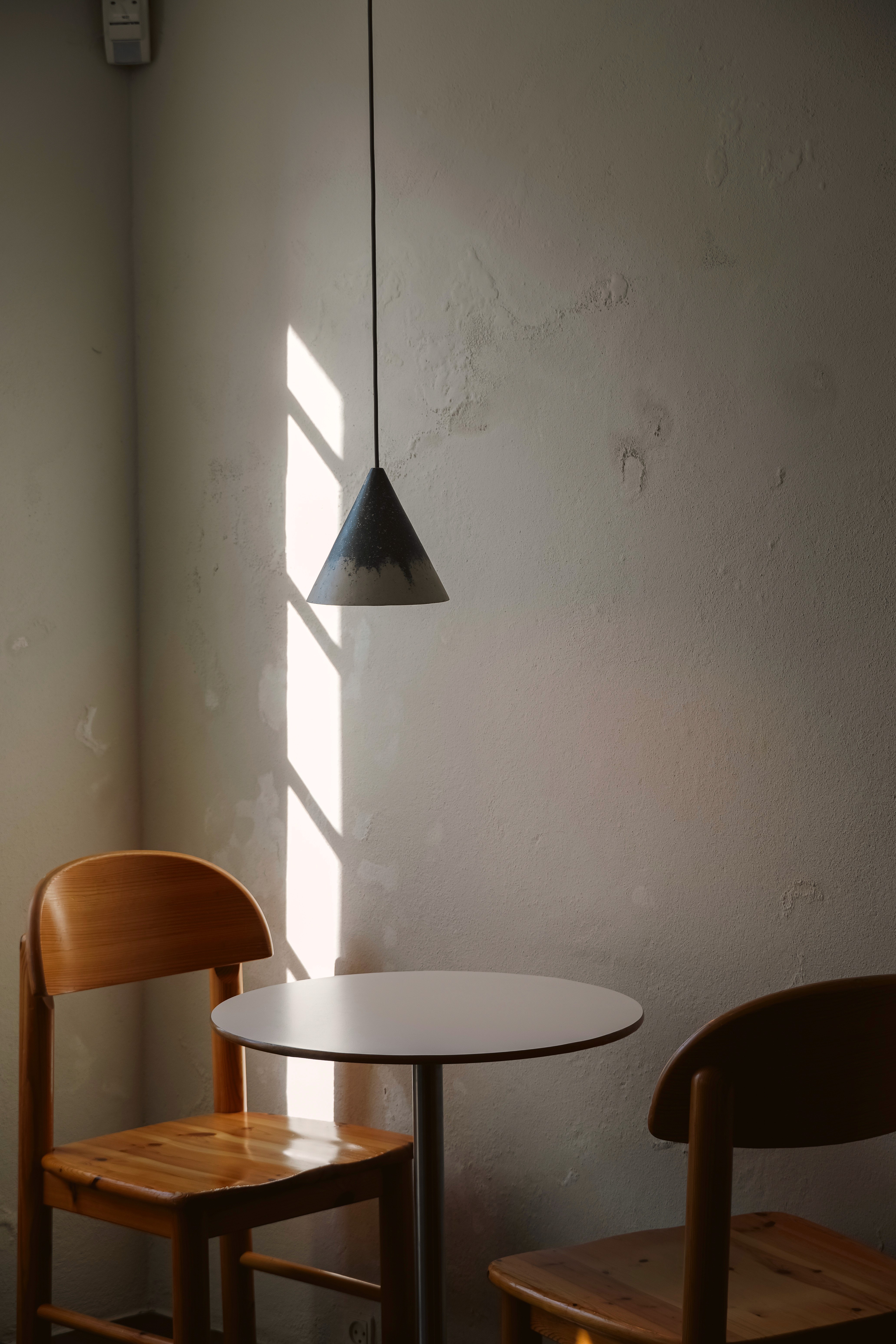 Silhouette of a person's face behind a wet surface.