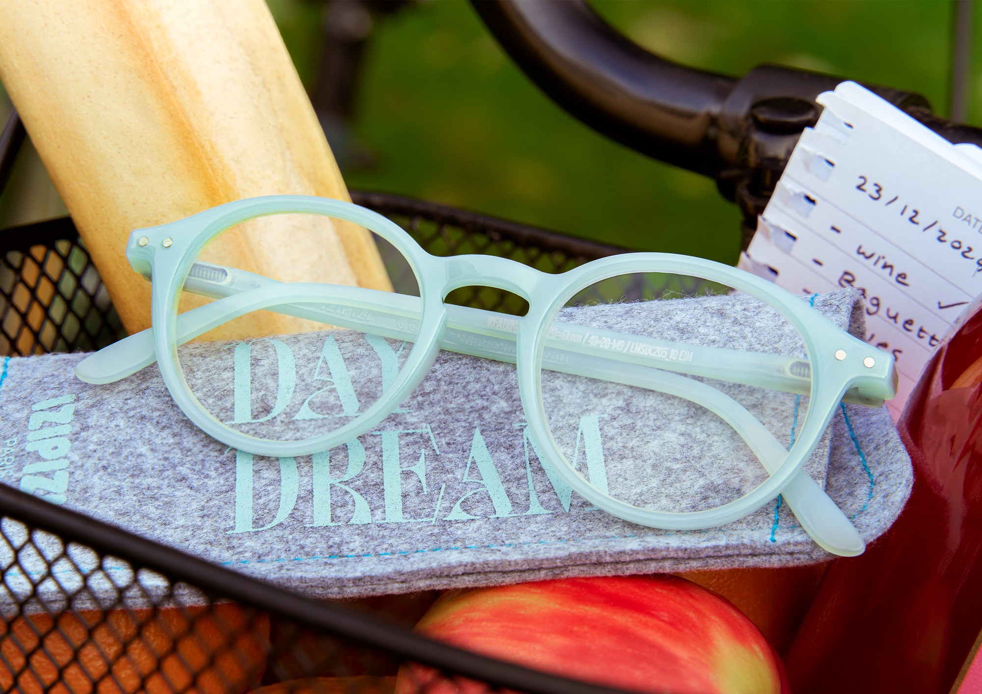 Izipizi glasses in the front basket of a bike, photographed by Matthew Brown.