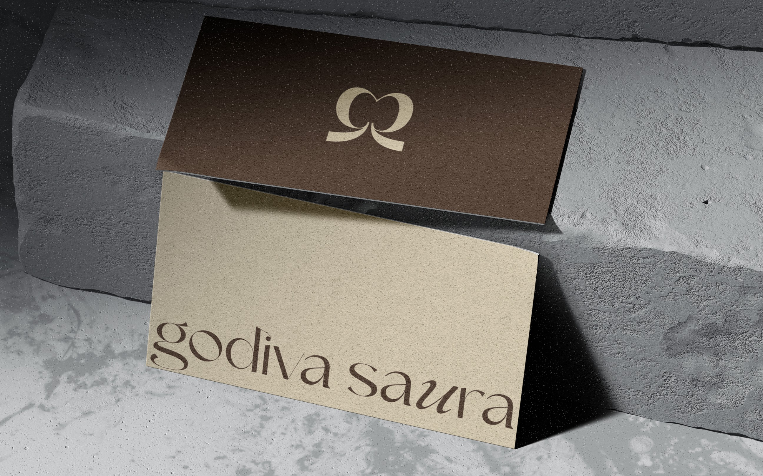 Brick waterfront building with large glass windows, reflecting the warm glow of a sunset over the river.