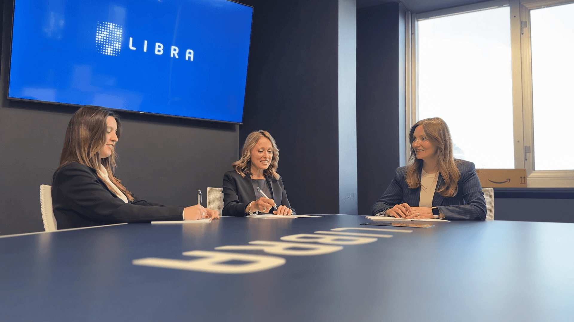 a person stacking coins on top of a table