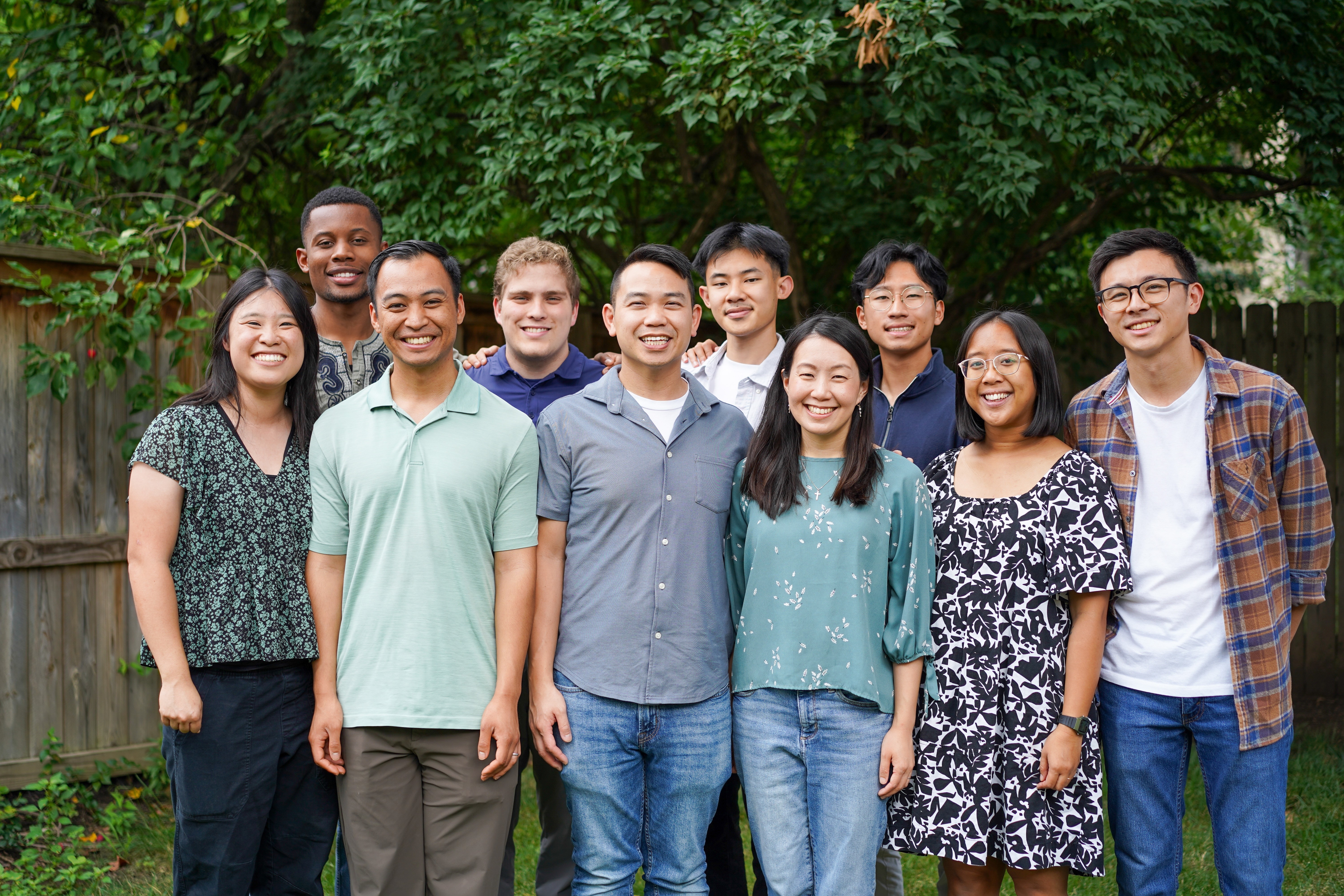 Anchor Christian Fellowship student leadership team posing together under a tree on campus