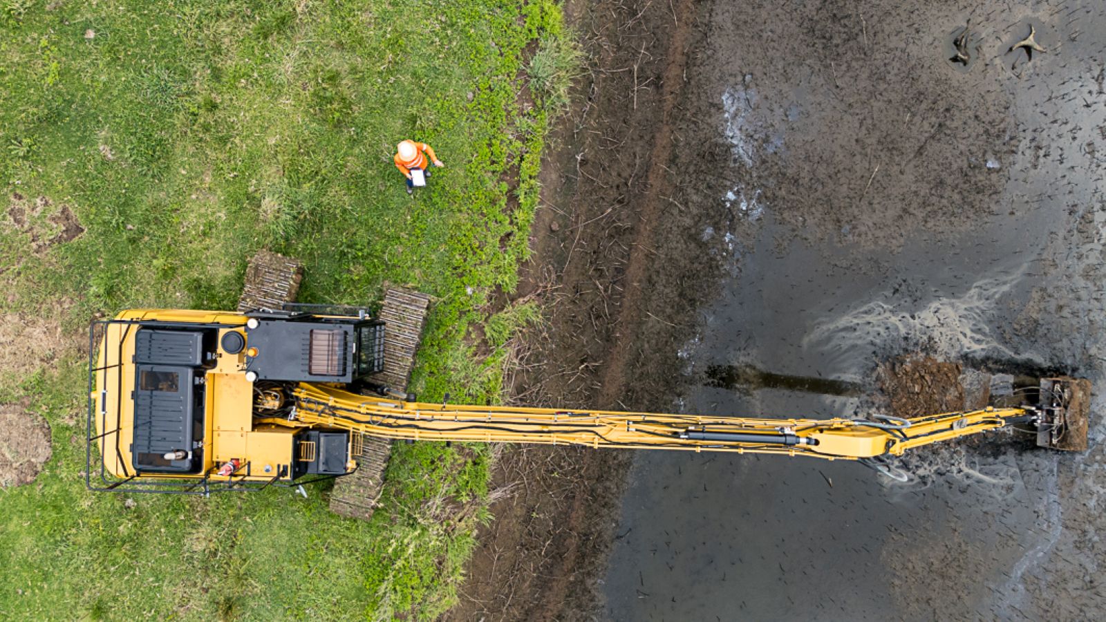 Construction works at a sewage treatment plant site, including excavation and waterway management overseen by Uminex