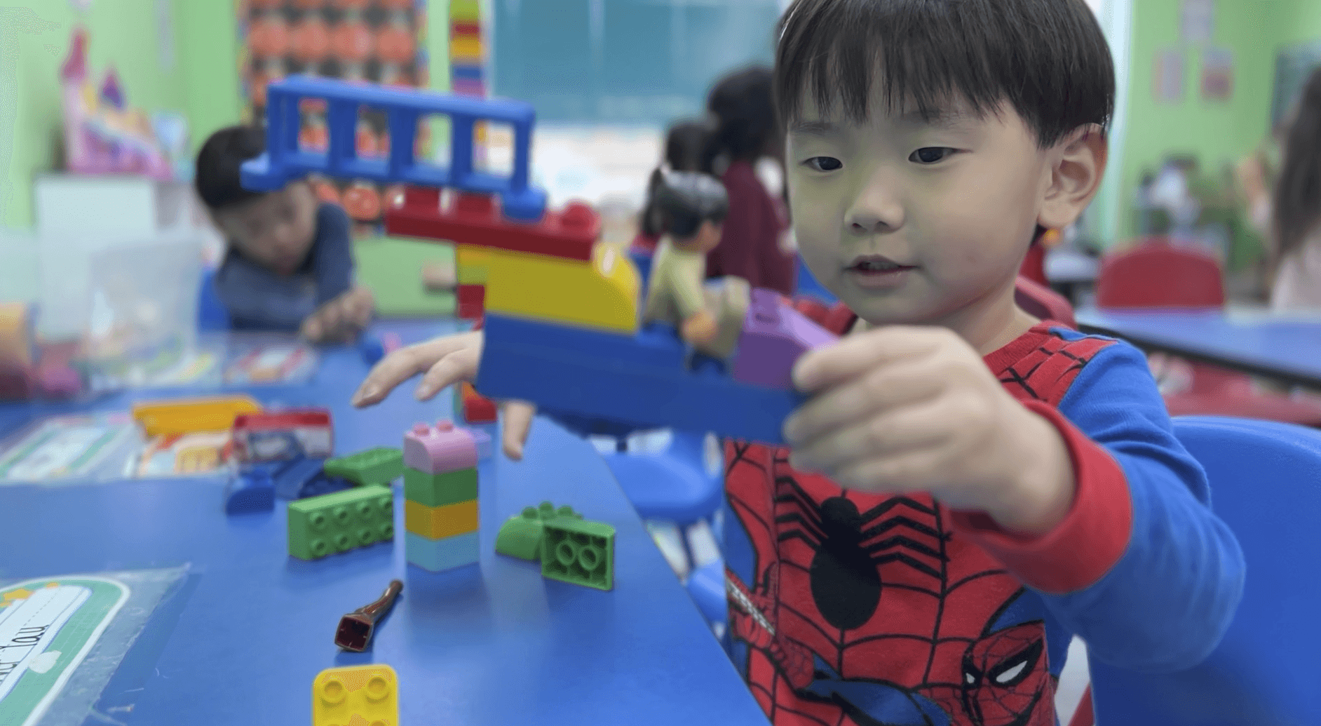 Play-based Experience Curriculum fostering growth at Blooming Buds Day Care and Learning Center, Syosset, NY.