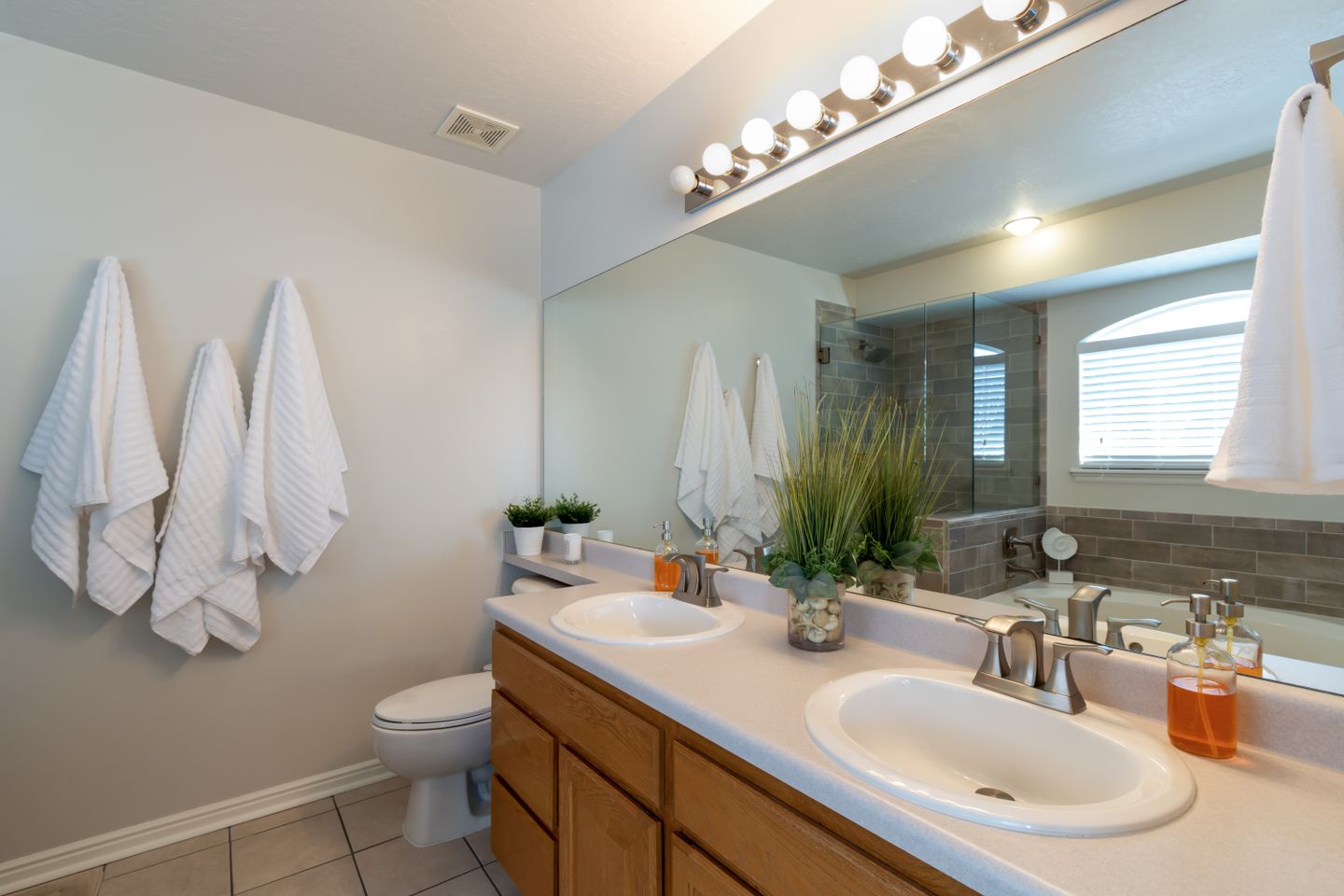 Clean home bathroom with a double vanity and fresh towels