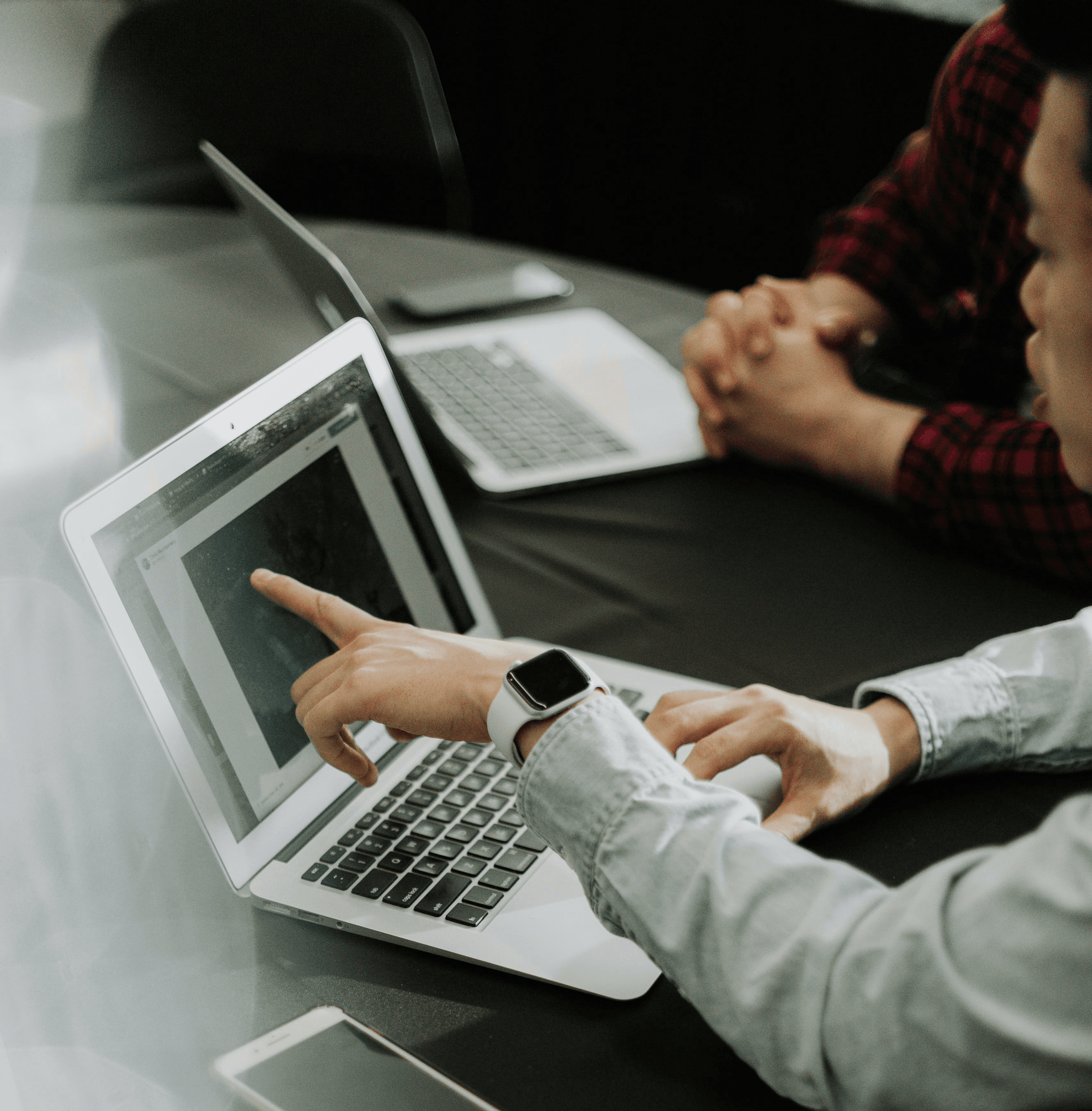 person using silver MacBook