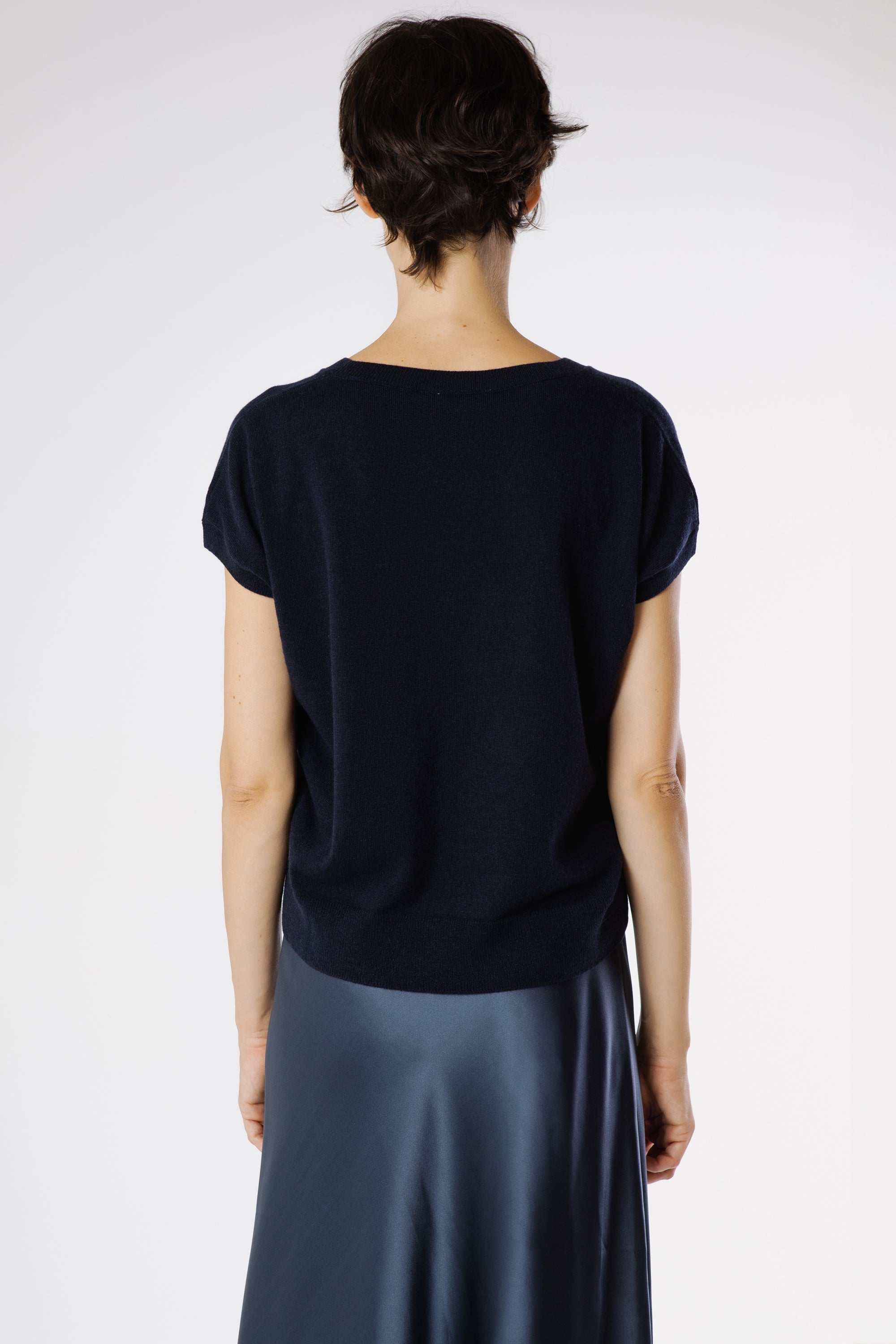 Back view of the Hamlet Cashmere Pullover Beluga showcasing the clean lines, smooth drape, and refined minimalist design.