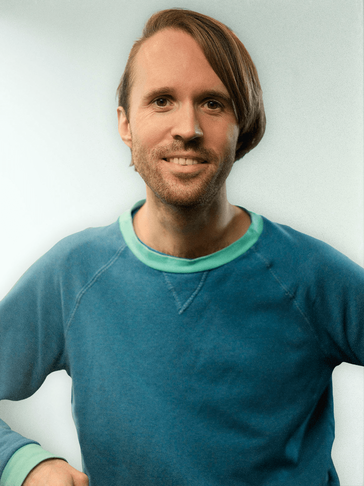 man standing beside wall