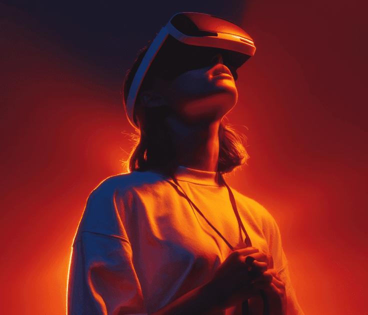 A woman wearing a virtual reality headset, immersed in a digital experience, with a focused expression on her face.