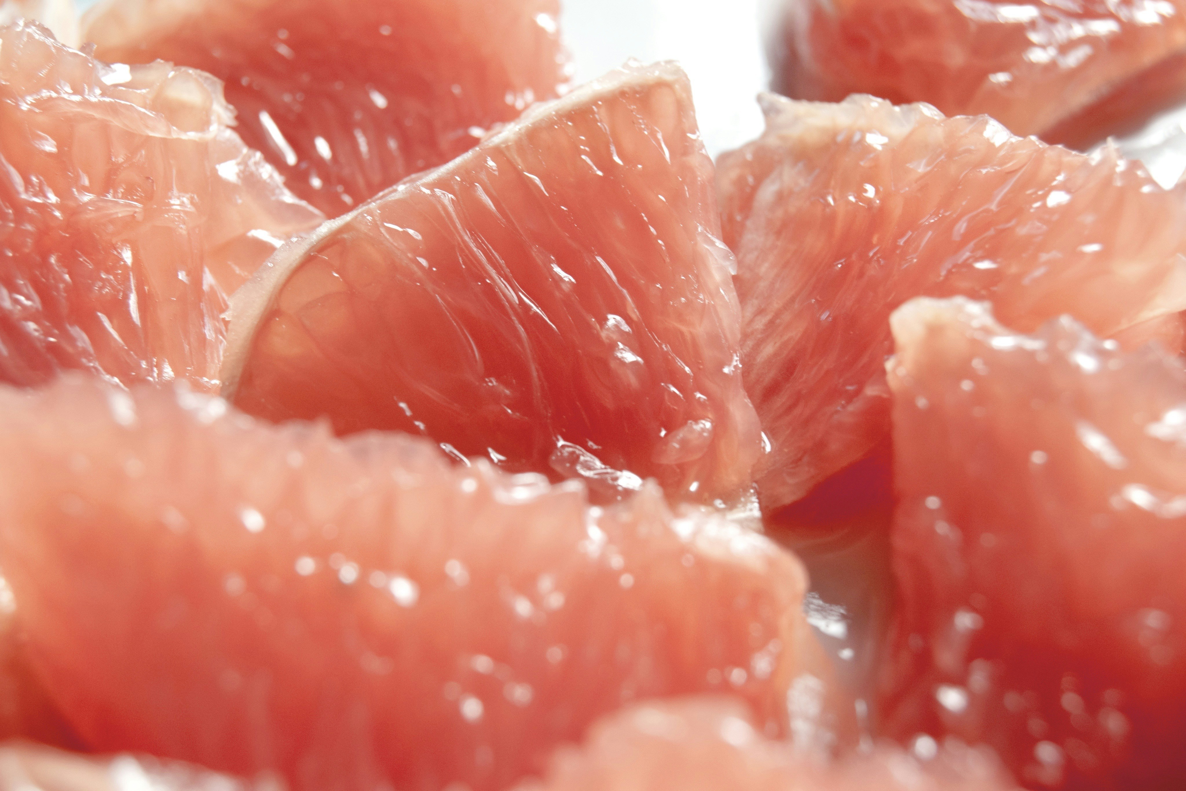 Separated grapefruit pieces showing the inside flesh