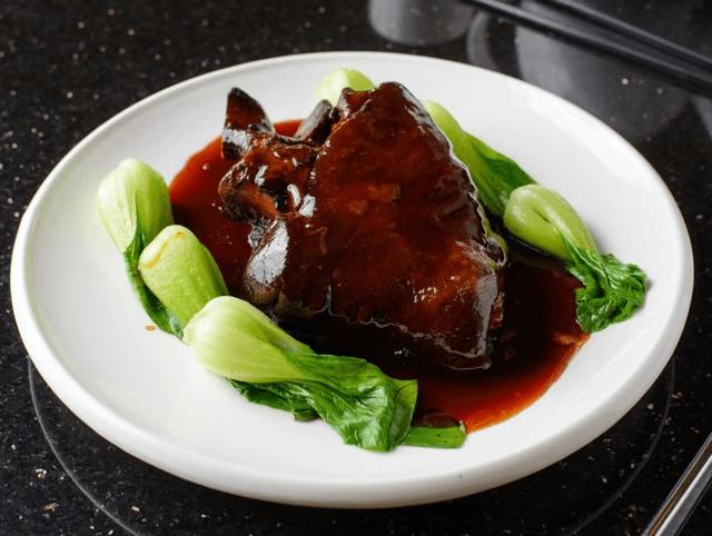 Rich and tender roast pork hock from Shanghai Times, slow-cooked to perfection for a true taste of Shanghai.