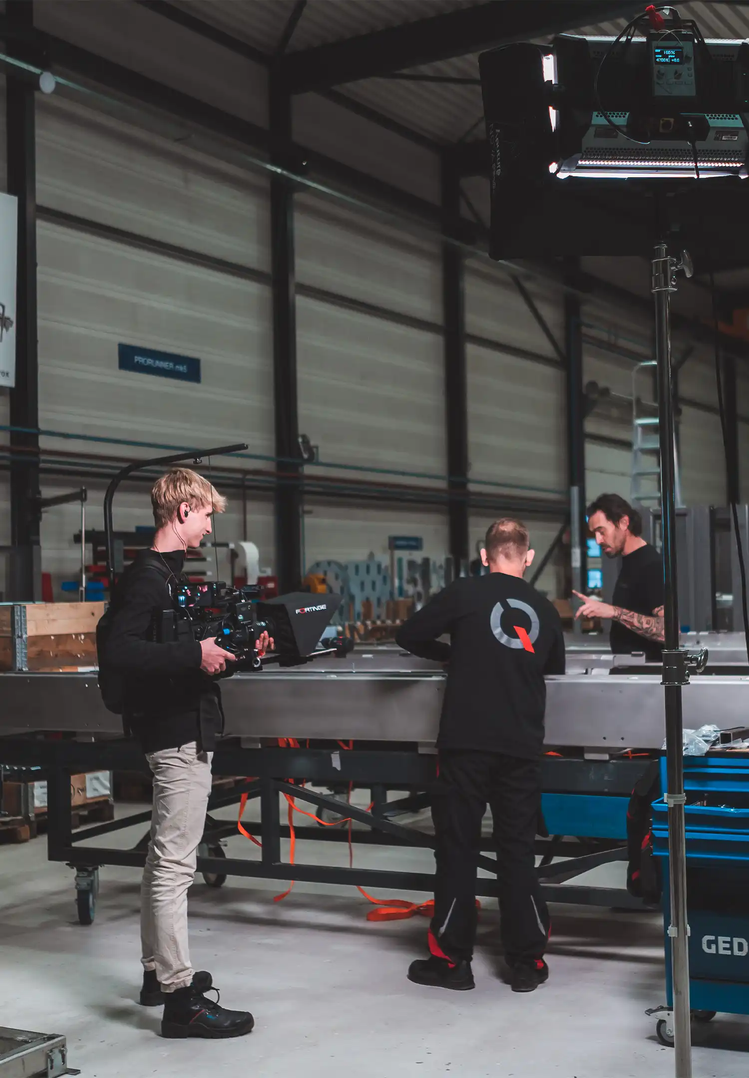 Cameraman from Indall is filming video footage on location