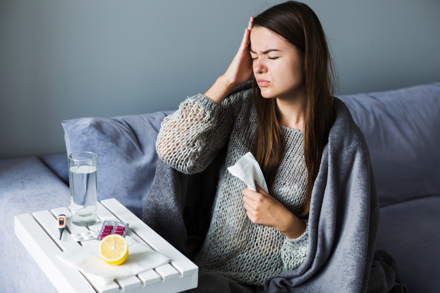 Girl feeling sick holding one side of head