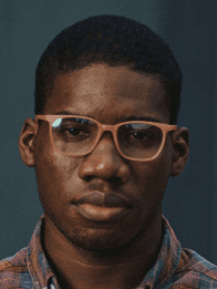 A young man front view orange glasses