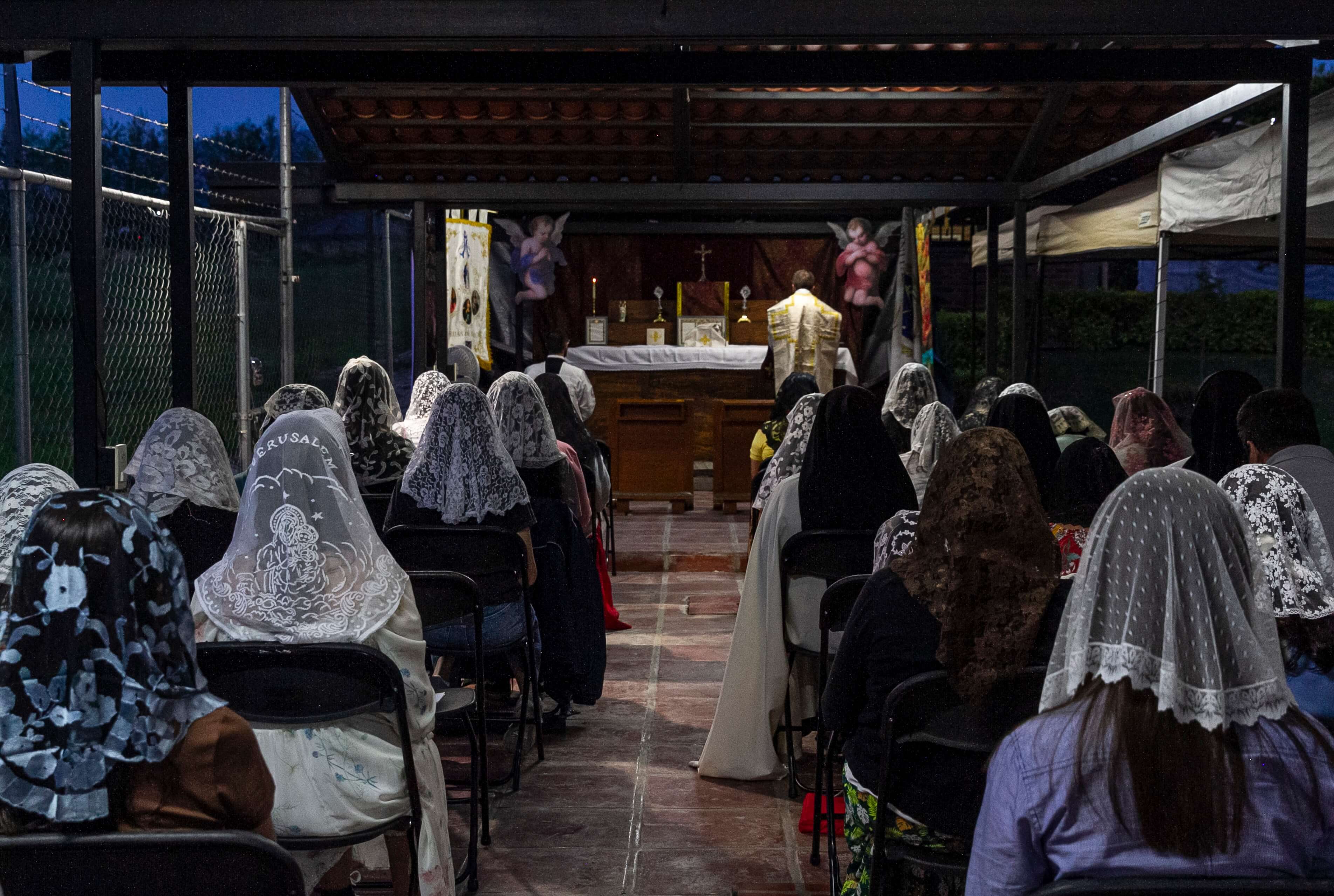 a group of children sitting on steps in front of a building
