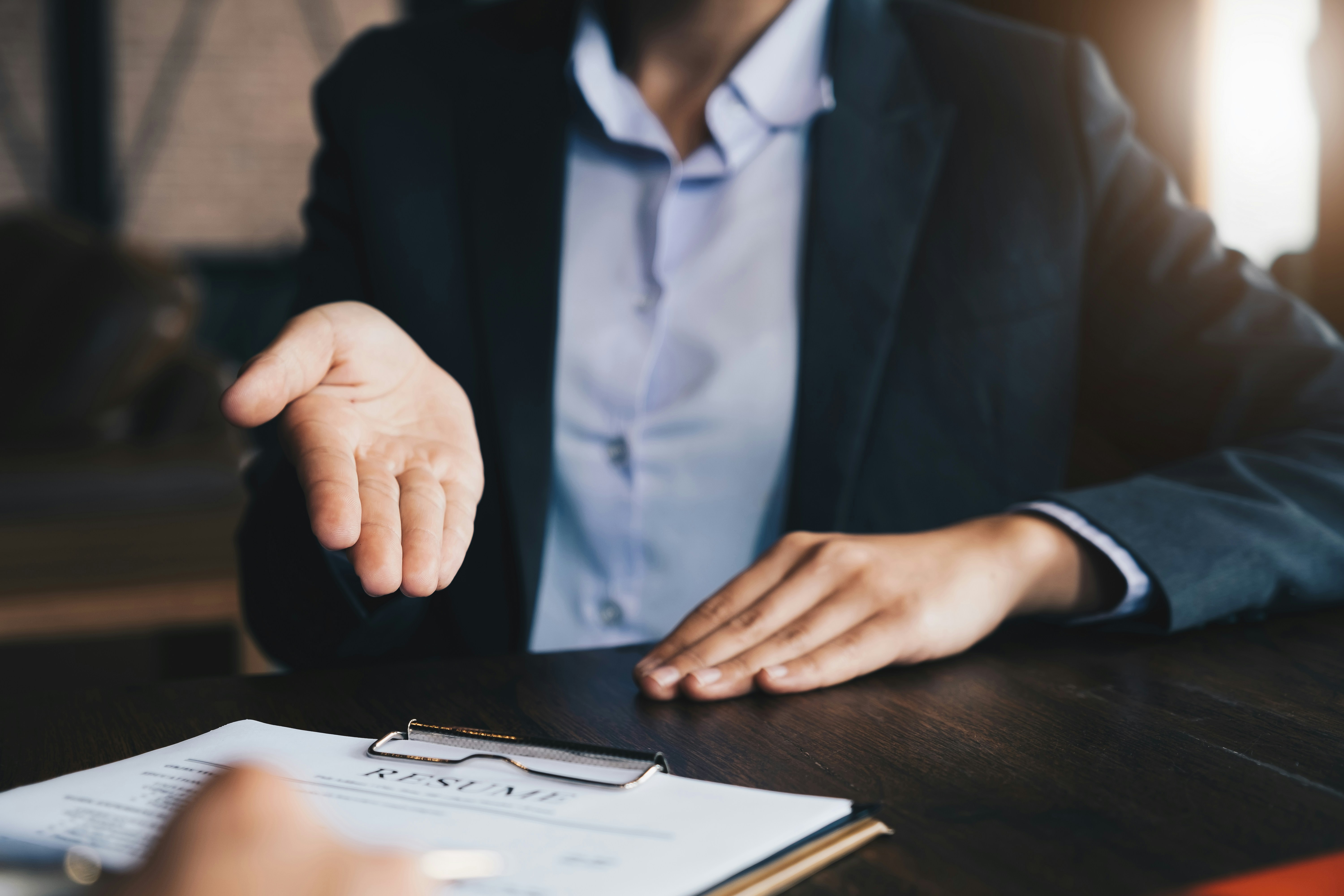 Recruiter reviewing a resume during a job interview