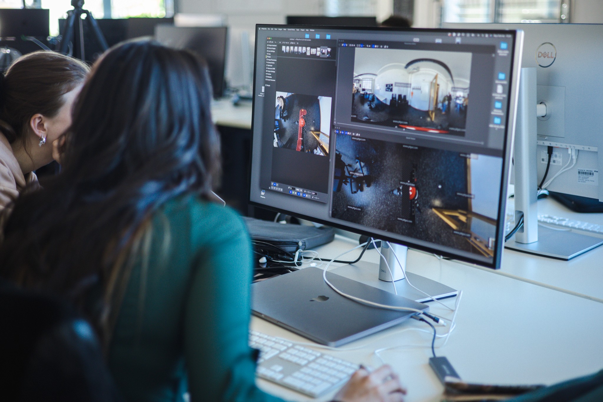 Hands working on a device or document, representing professional results delivered to clients.