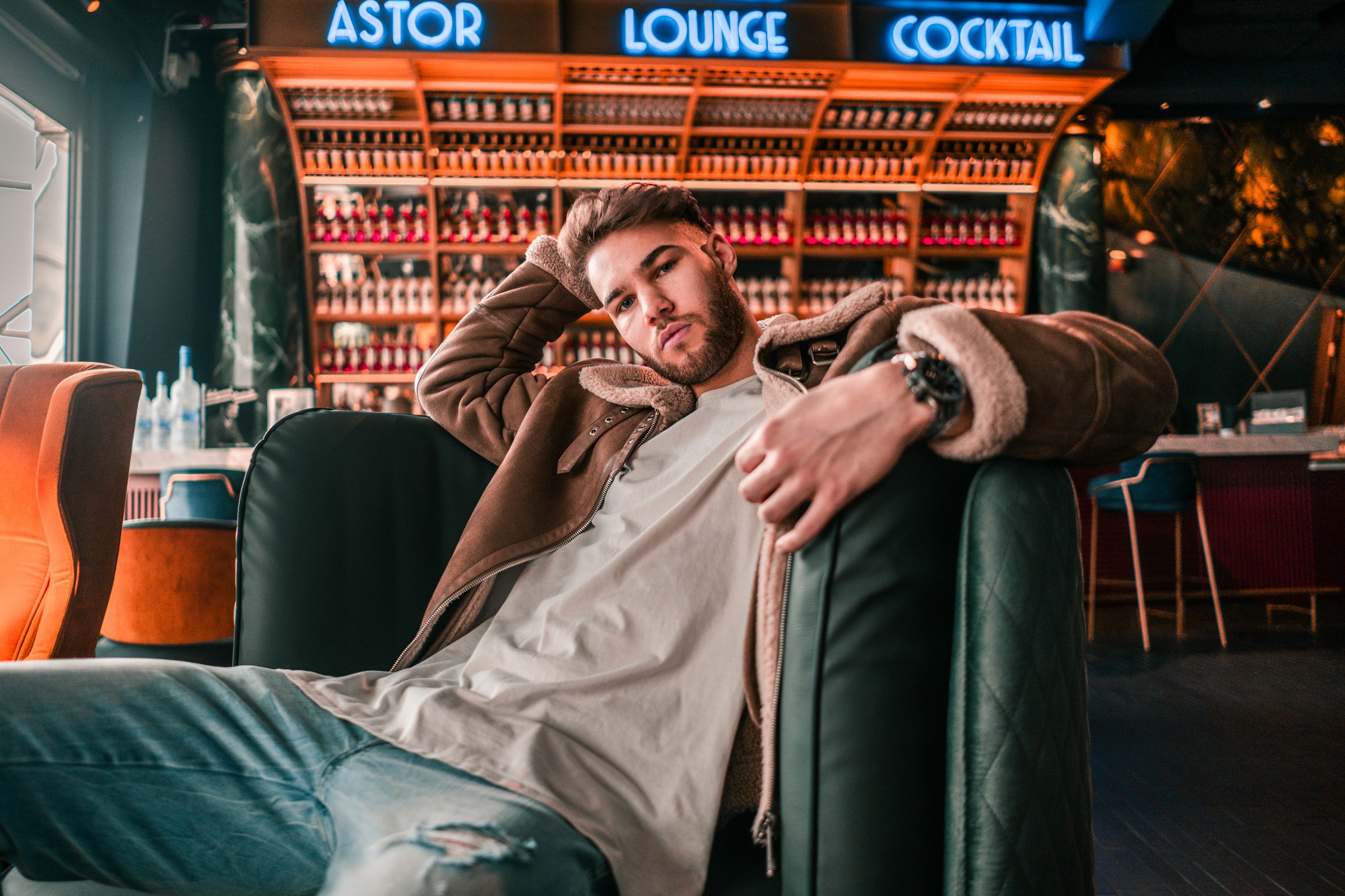 man sitting in cafe - What Color Goes with Brown