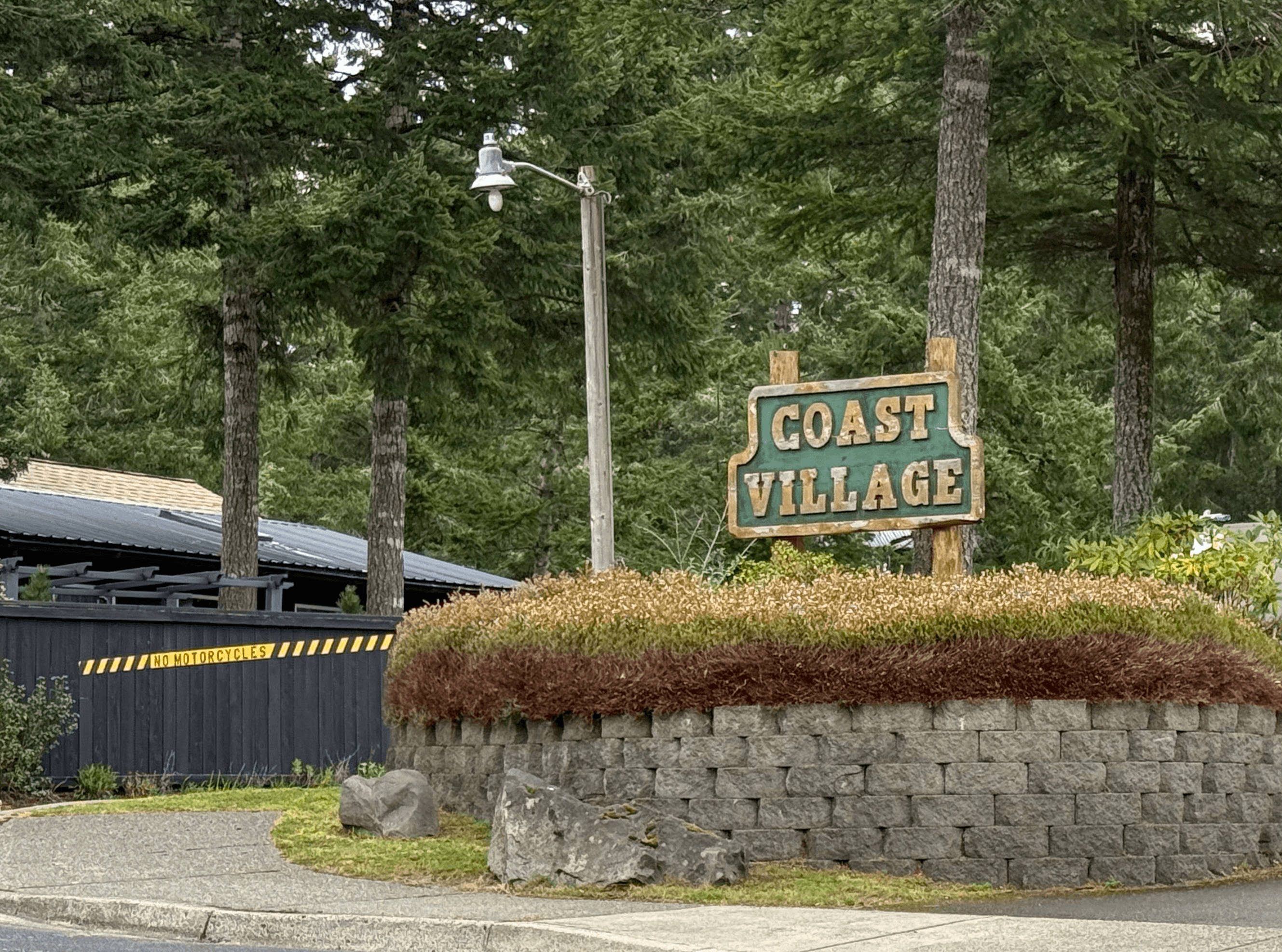 five children smiling while doing peace hand sign