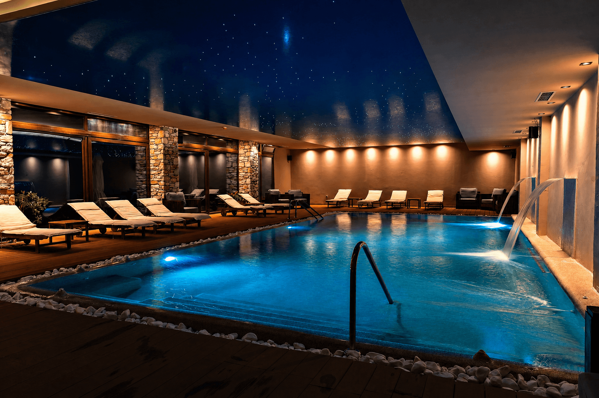 Indoor swimming pool at Manthos Mountain Resort & Spa, with a star-lit ceiling and poolside loungers