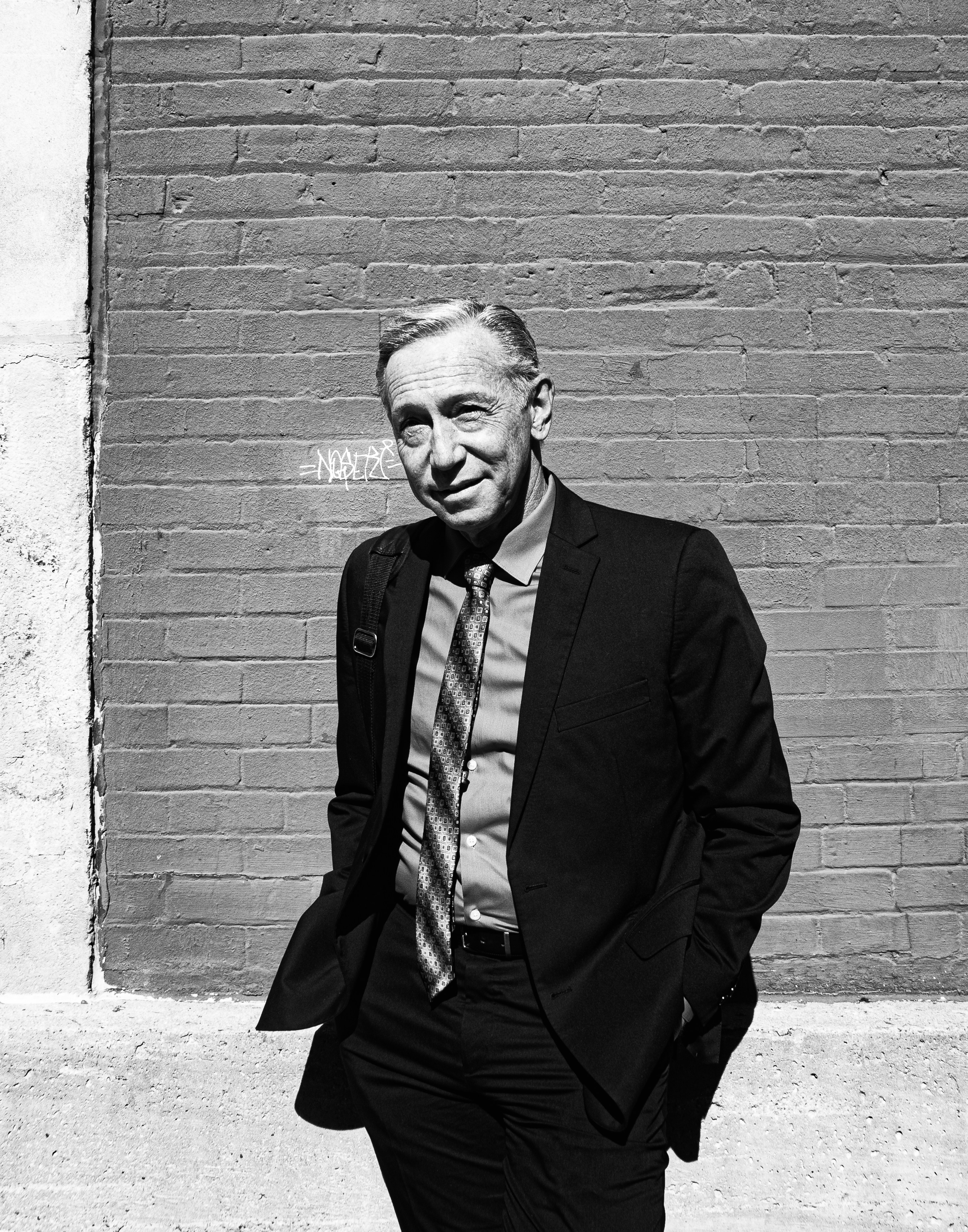 greyscale photo of man who is the founder of the company