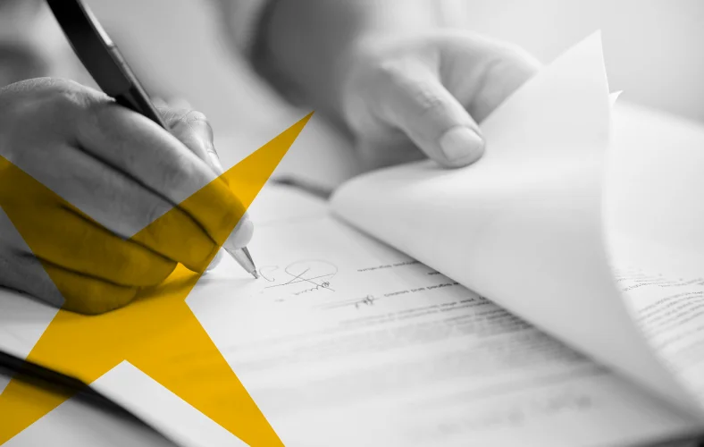 Legal professional reviewing and signing documents, representing AI-powered legal document analysis