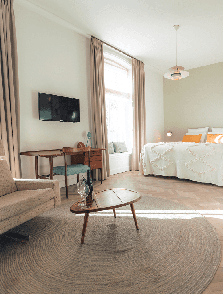 Sage green walls bedroom with lilac duvet and modern style