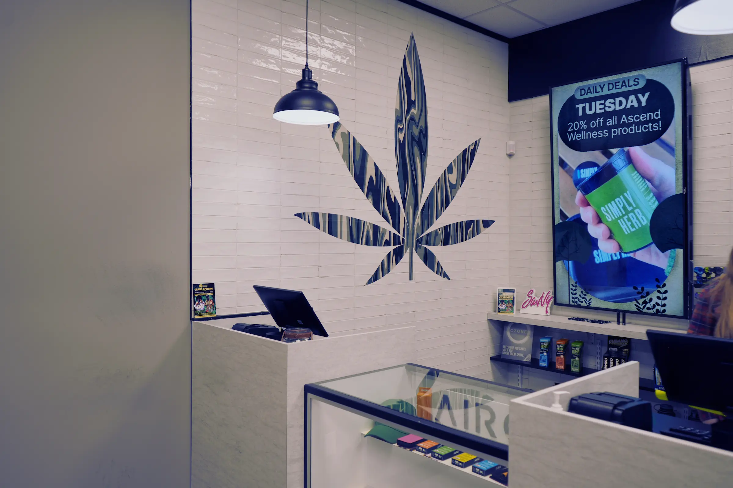 Organic Farms retail counter with cannabis leaf signage