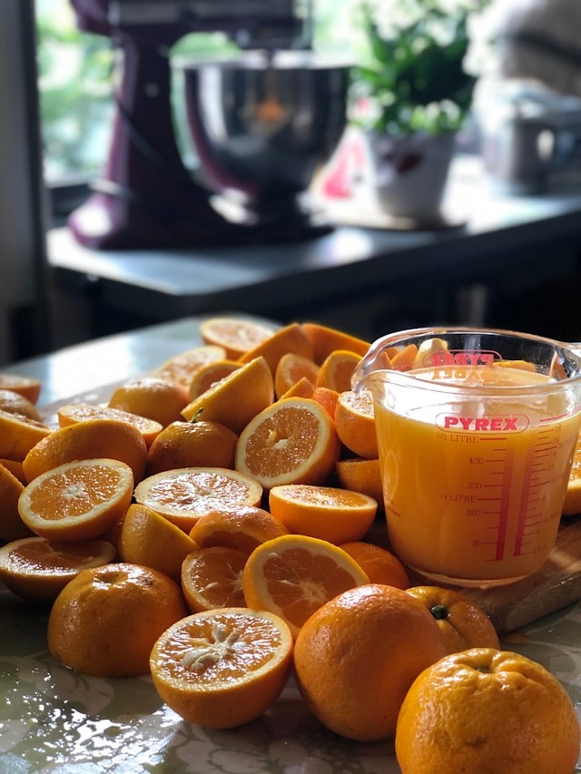 Freshly squeezed orange juice and oranges