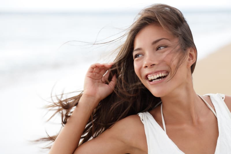 woman smiling at the beach