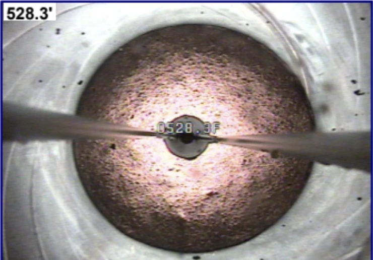 two men working on the roof of a house