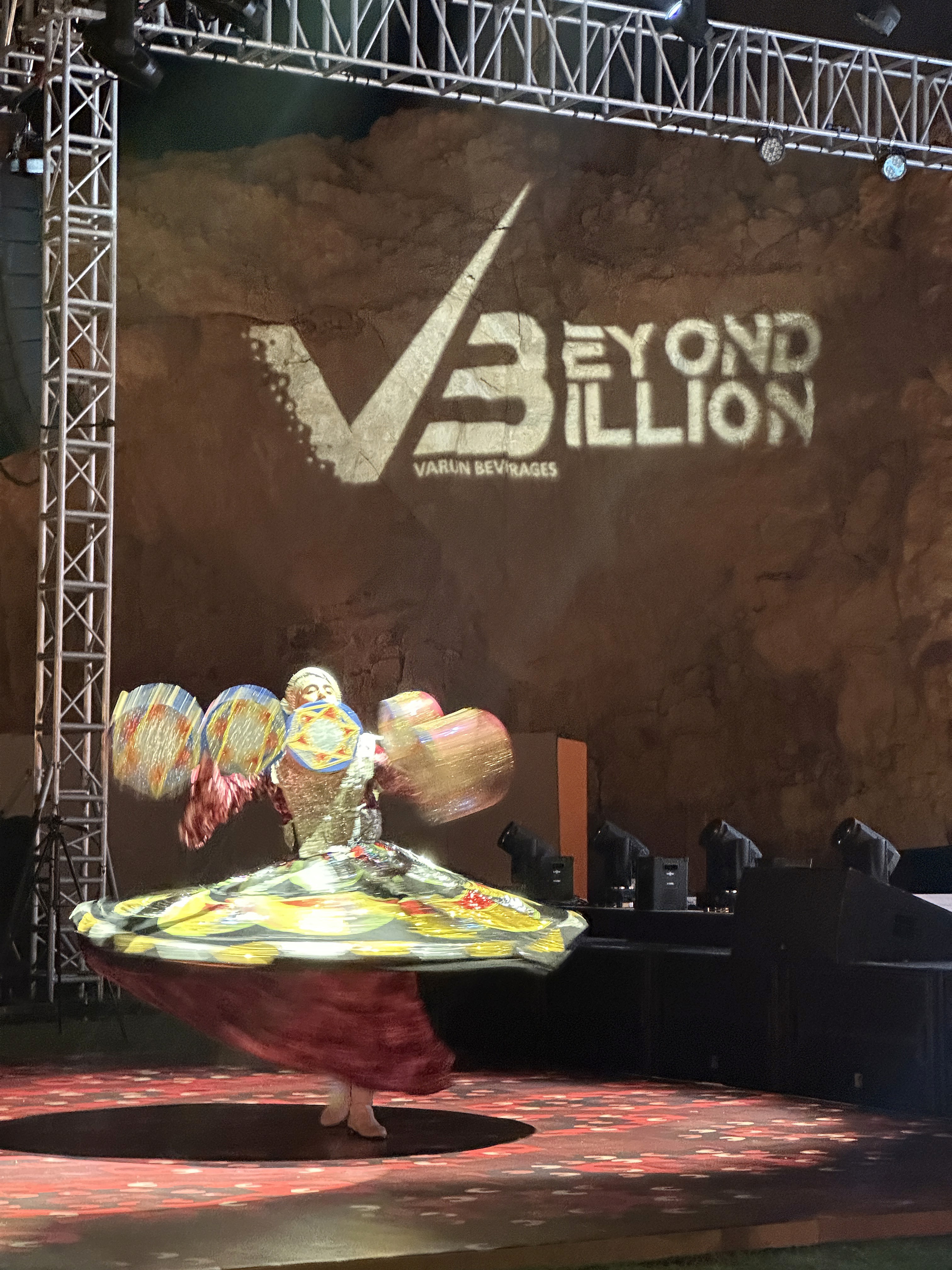 Tanoura dancer performing on stage at Varun Beverages corporate retreat in Oman