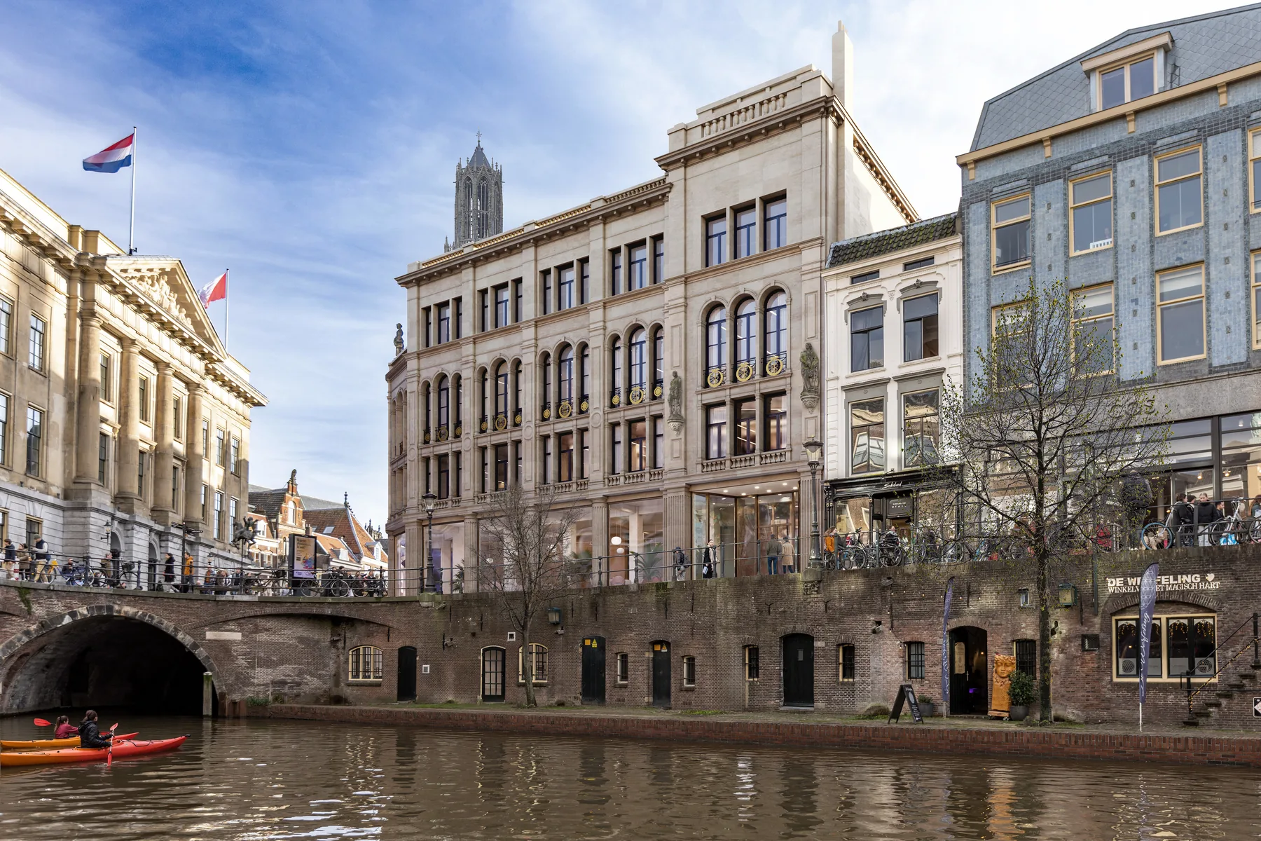 Historic facade of Magazijn de Zon along Utrecht canal — heritage restoration exterior