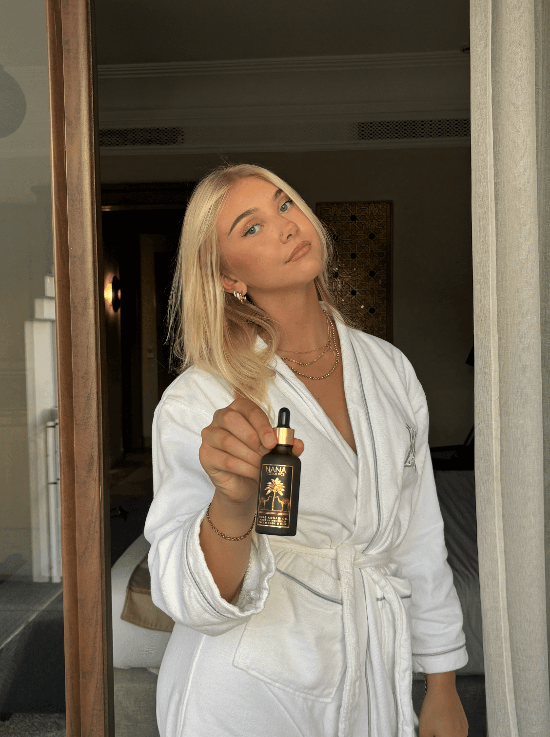 Beautiful woman smiling with her hands on her cheeks