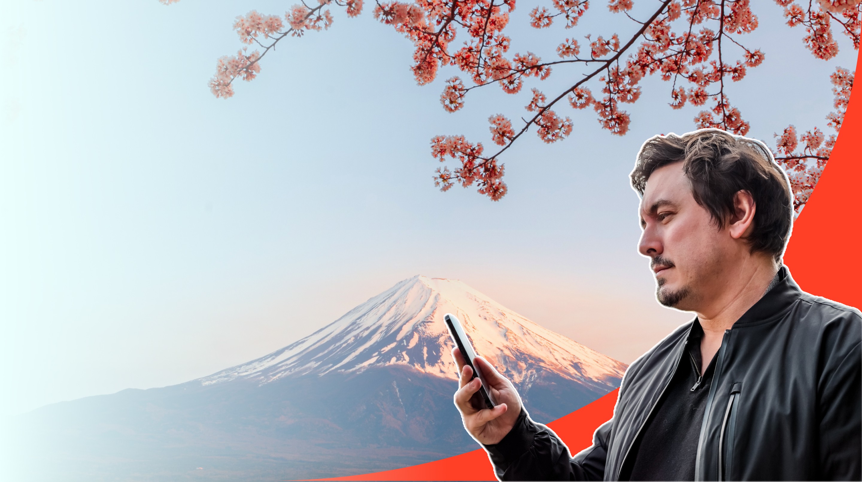 Chris Broad holding a phone with eSIM in front of Mt. Fuji