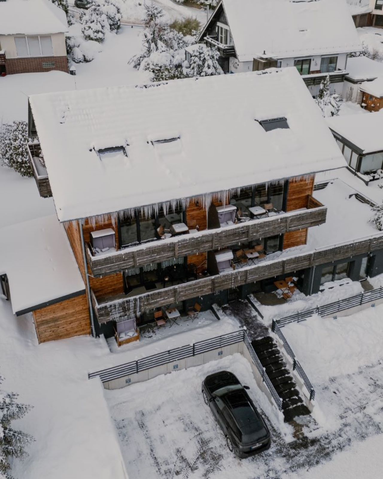 Aerial view of a dense cityscape with skyscrapers at sunrise.