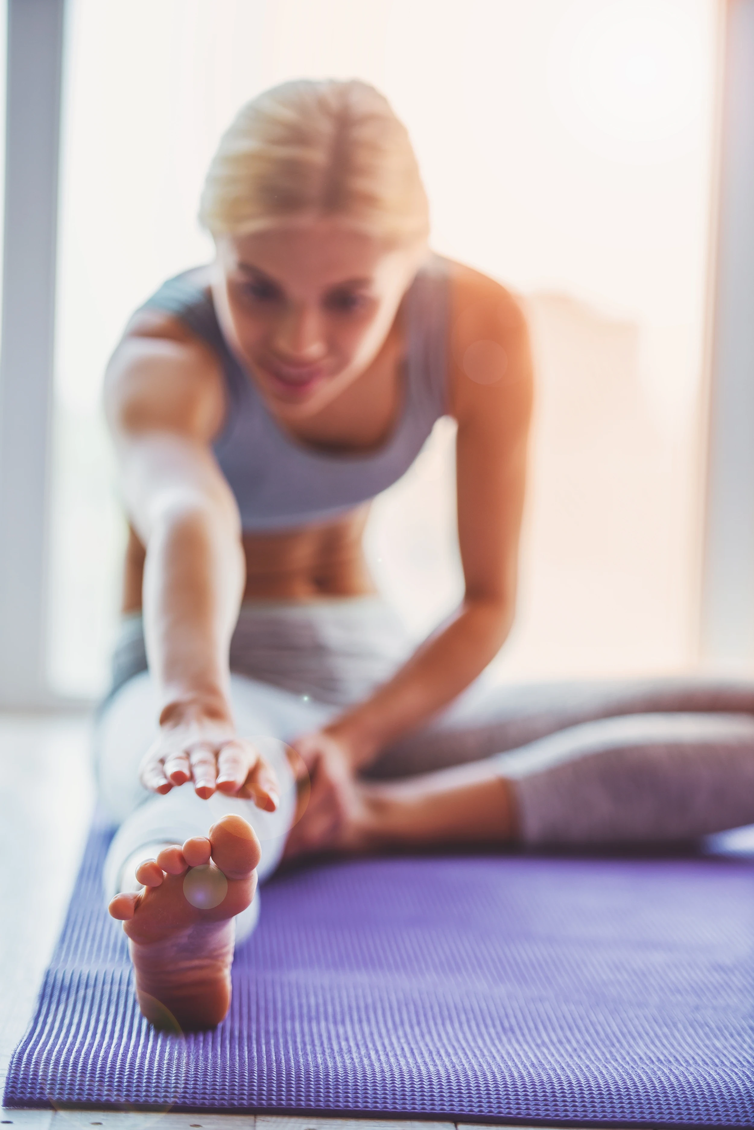 Woman practicing yoga meditation representing wellness and guided sessions.
